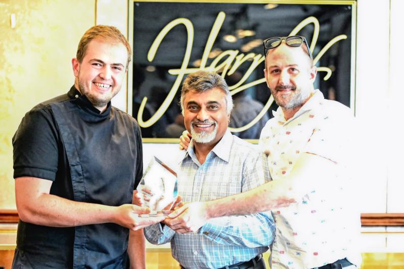 Gathered for Dalmata’s second-place tie award presentation are (l-r) Benji Langer, Harry Keswani and Kevin Daughaday.